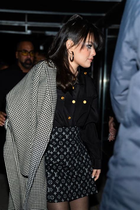 Selena Gomez Wears Miniskirt and Houndstooth Coat .